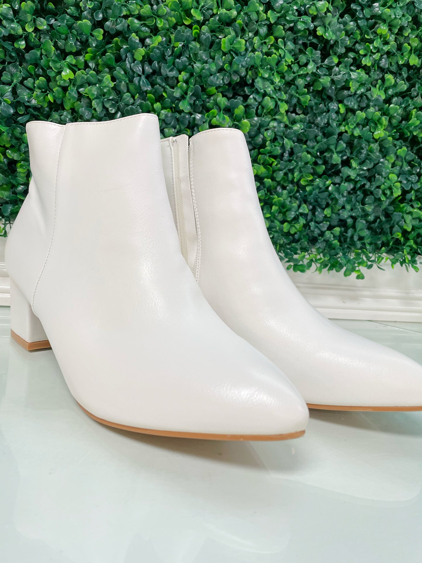 White pointed toe mid heel ankle booties