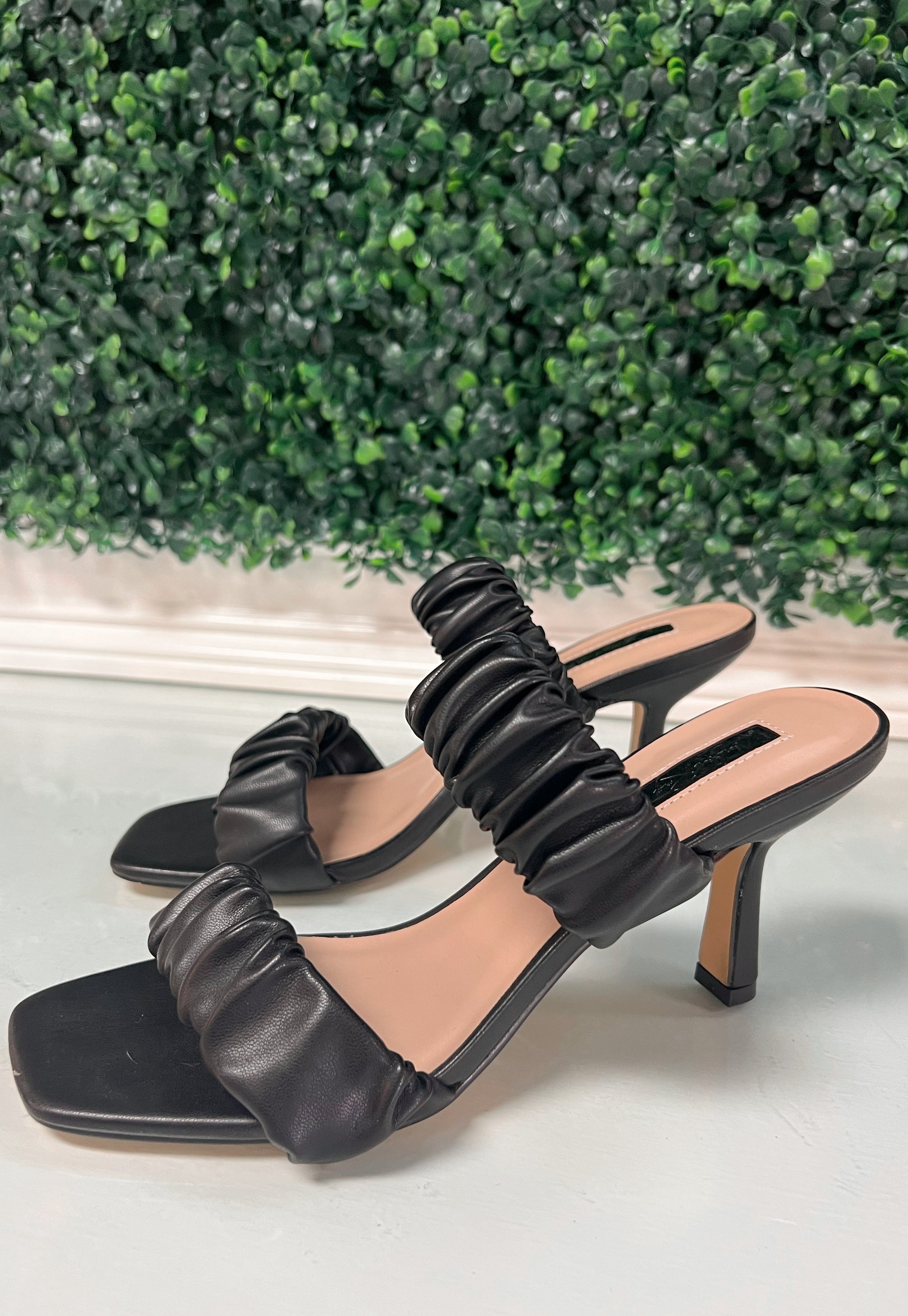 Black faux leather heels with ruffled thick straps