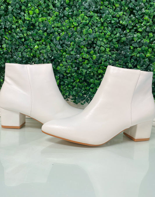 White pointed toe mid heel ankle booties