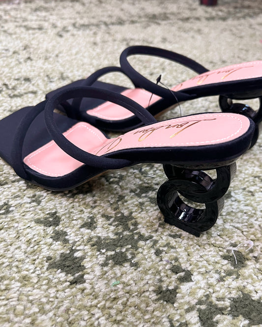 Black double strap mid-heeled sandal with a unique heel consisting of 2 interlocked circles